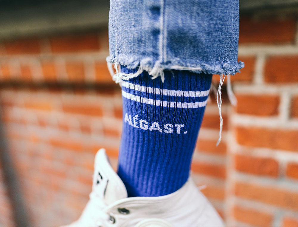 Blauwe sok met opdruk ALEGAST.