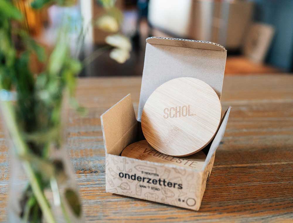 5 onderzetters in hun verpakking.