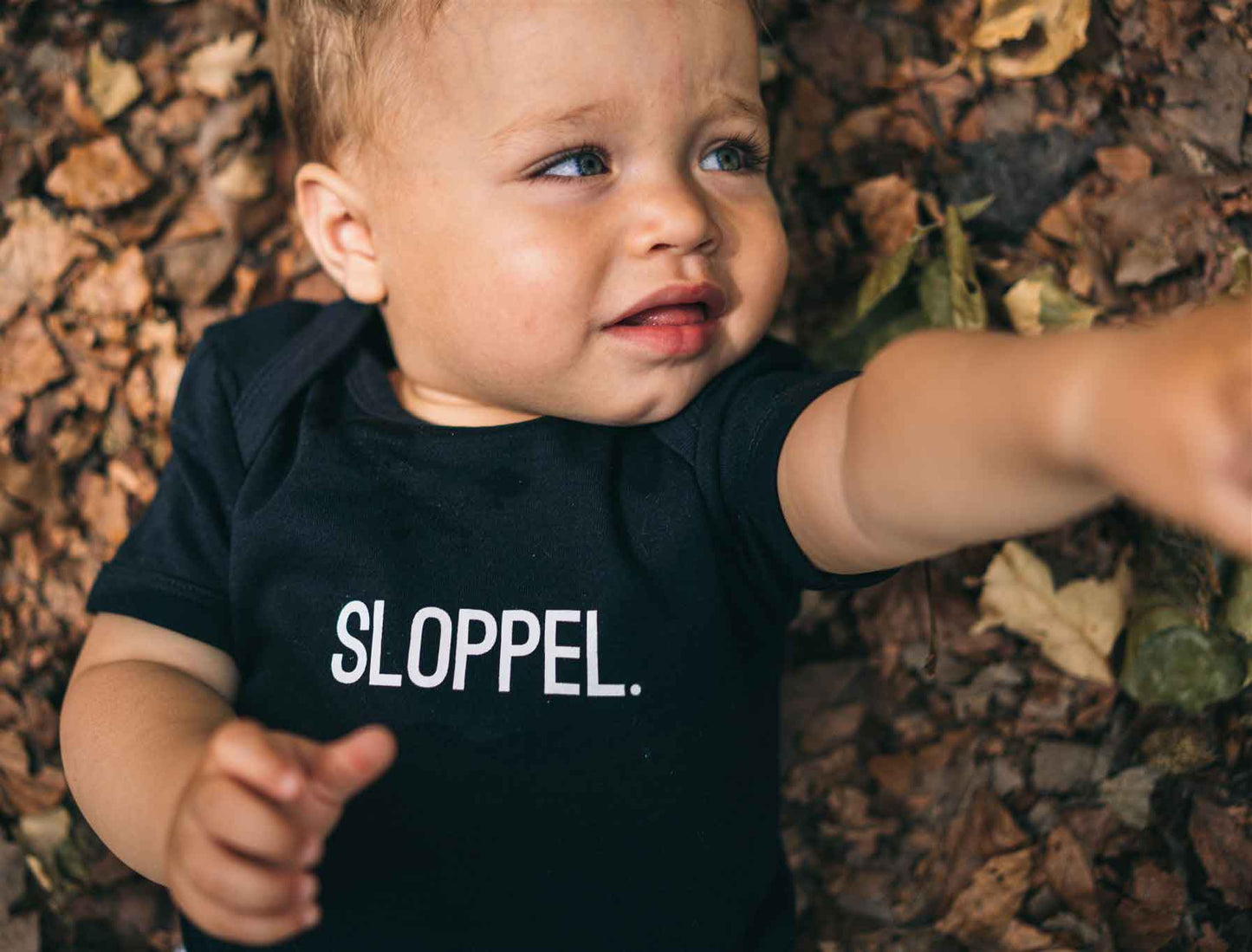 SLOPPEL. Baby body zwart voorkant