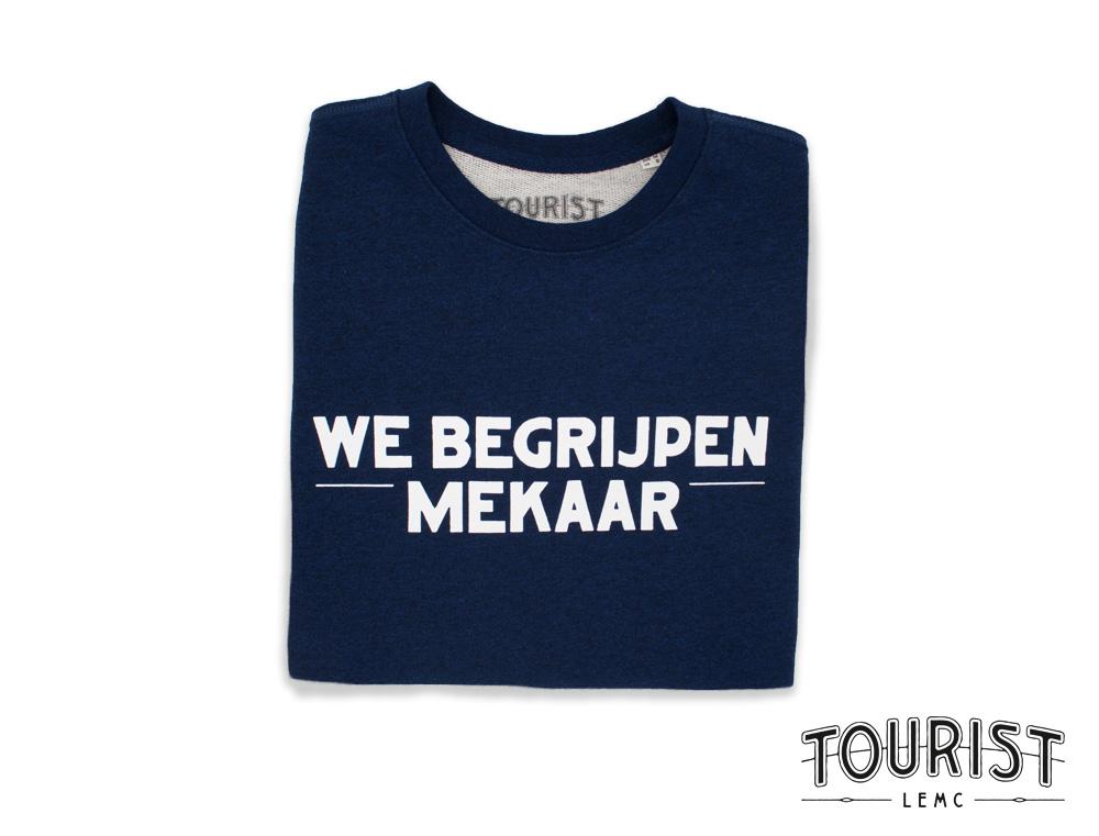 Blauwe trui met opdruk we begrijpen mekaar.